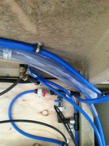 The 2 taps for isolating the tanks from the mains connection if required can be seen on the timber panel. the clear hose is for filling the Non-potable tank from can or pumped from a creek.