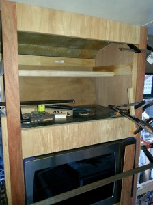 The face panels being applied to the Cabinet. 