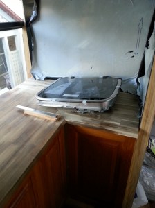 Cook top in position the Splash back is Black Aluminum Composite paneling.
