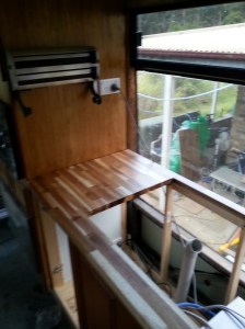 The dispenser for Paper towels ETC mounted to Micro wave cabinet adjacent to power point & Ventilation switch. 