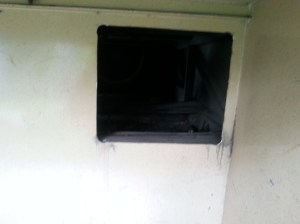 the access hatch hes been cut in the rear of the forward most Bin on the passenger side behind where the Washing machine is normally mounted.