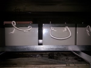 View of the batteries in place after loading through the access hatch, the clamps are yet to be fitted & Electrical cables & shunts for meters waiting for connection. This shot is from the drivers side before installation of the Air Conditioner units.