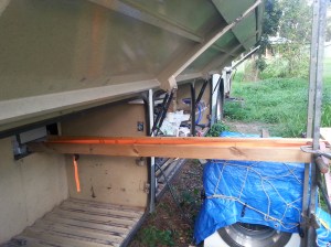 Washing machine on the ground during the installation of the Battery system, once completed the hatch cover can be re-installed & the washing machine refitted.
