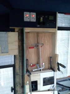 The recessed center compartment is to house the 2 Solar controllers, the NG rosewood ply is in the process of being applied.